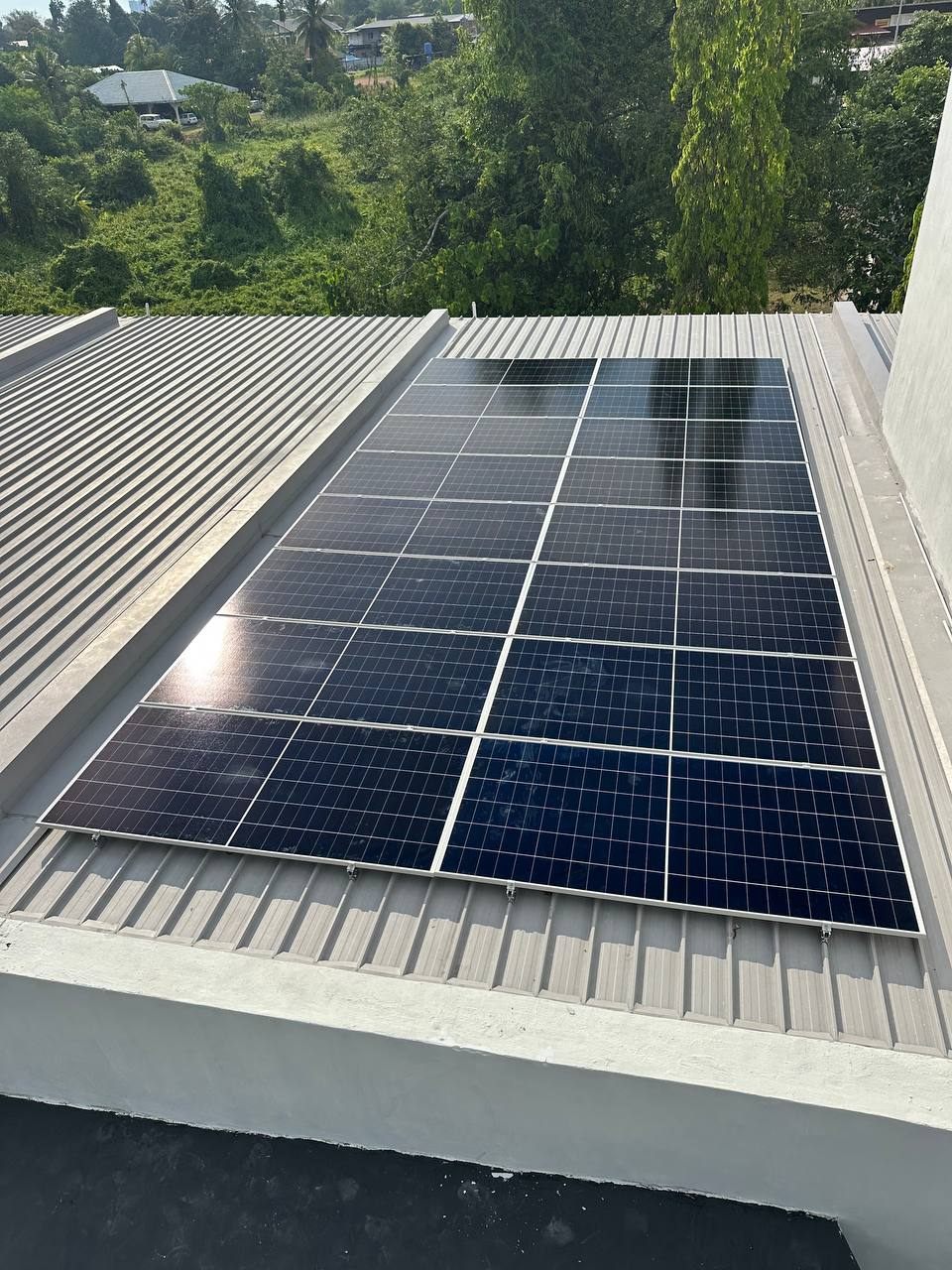 Residential rooftop solar array on a metal roof
